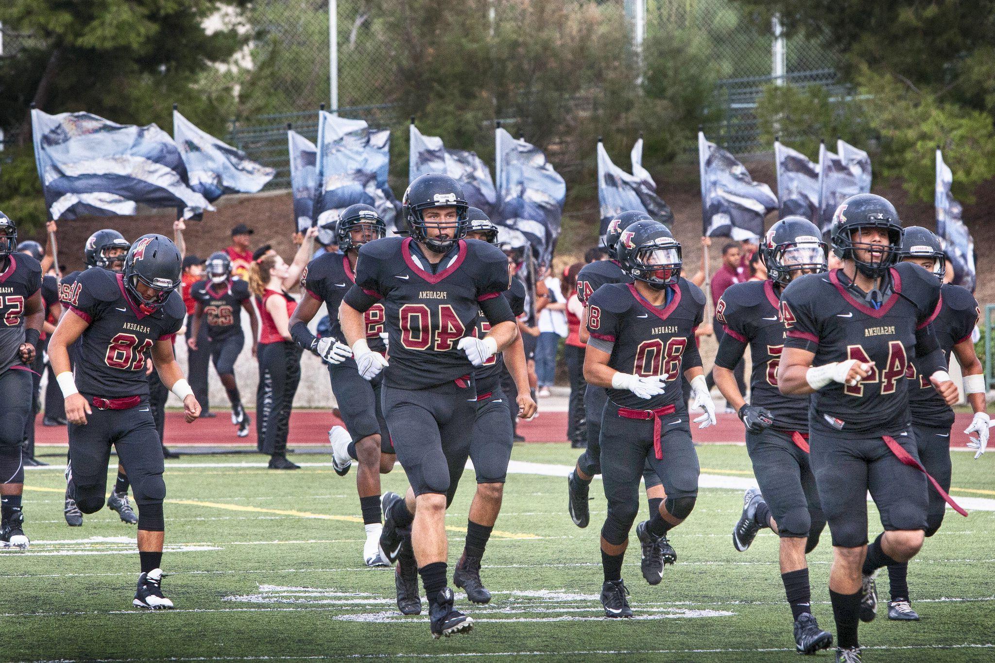 The PCC Footbal team takes the field.